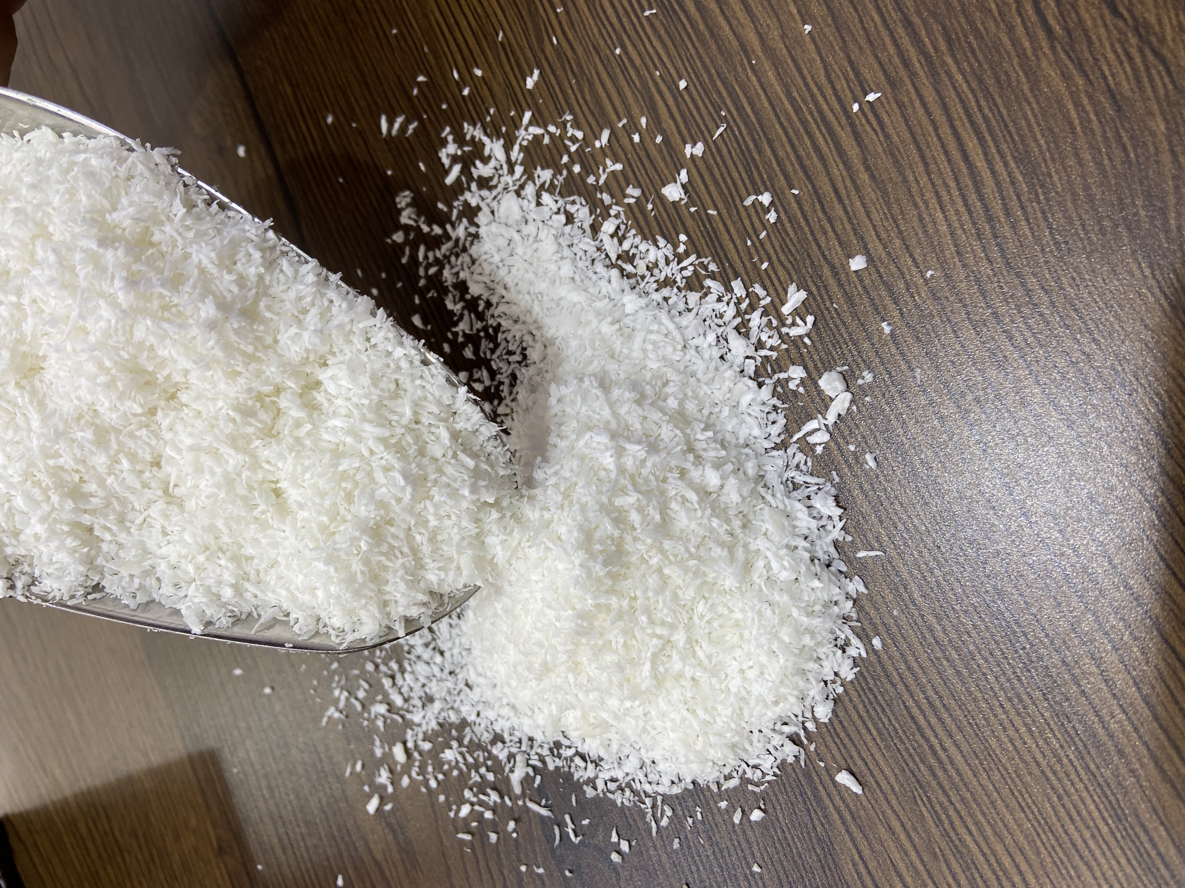 White desiccated coconut on the desk.